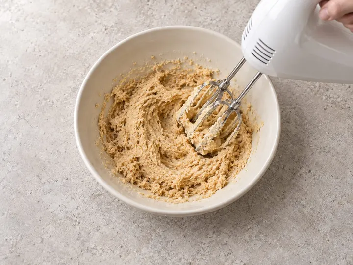 Step 1: Beat the butter, brown sugar and white sugar in a bowl until fluffy.