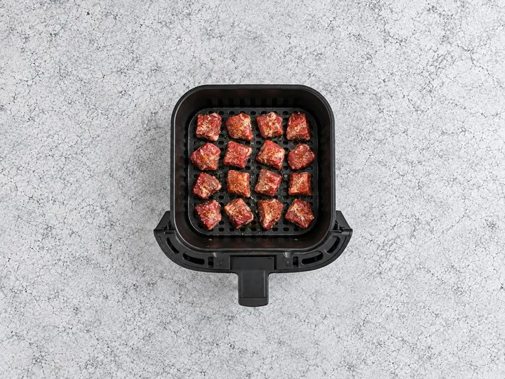 Step 4: Spray the basket tray. Spread the steak bites on it in one layer. Cook in batche