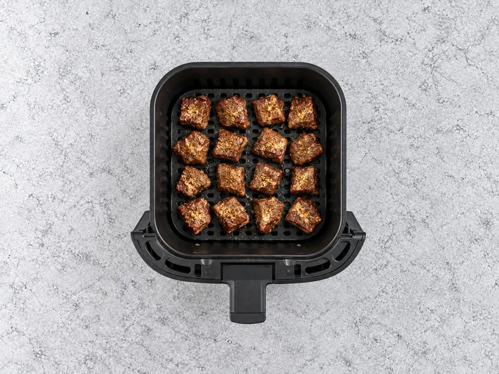 Step 7: Air fry the steak bites until the garlic is browned.